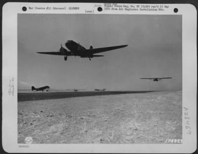 Consolidated > EQUIPMENT AND TROOP GLIDERS OF THE 82ND AIRBORNE DIVISION . . . Plane towing equipment and troops carrying glider. Invasion training under direction of 5th Army, commanded by Lt. Gen. Mark W. Clark. Oujda, Morocco, North Africa