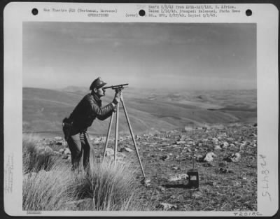 Consolidated > Berteaux, Morocco-1st Lt. Donald G. Gill, Communications Officer of U.S. Fighter unit obtaining the "True North" reading at a mountain lookout station.