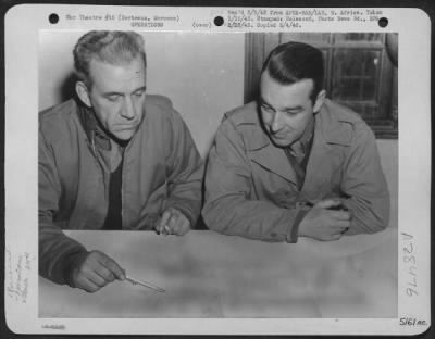 Consolidated > Berteaux, Morocco-Air Corps Intelligence Officers of the 310th Bomb Group in Morocco are preparing a raid on Axis held territory. (L to R) Capt. Gordon Locke, Phila., Penn. And his assistant, 1st Lt. T.P. O'Brian, Wheeling W. Va.