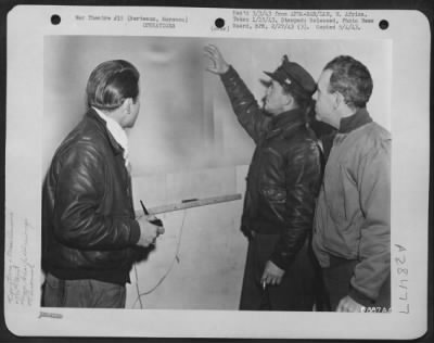 Consolidated > Berteaux, Morocco-Due to many quick surprise operations in African warfare the operations map of the 310th Bomb Group plays an important part. Pilot Lt. Walter Crump, Dallas, Texas reports to Capt. Gordon Locke, S-2 Section, shortly after return from