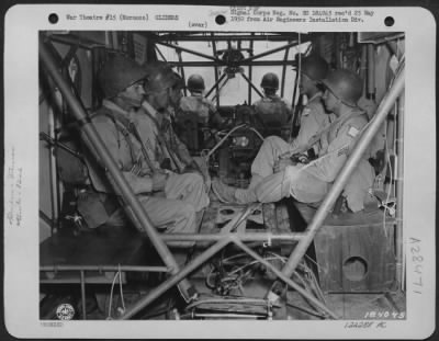 Consolidated > Members Of The 82Nd Airborne Division Seated In Glider After Loading In 75Mm Howitzer, Taken During Invasion Training Under Direction Of 5Th Army, Commanded By Lt. Gen. Mark W. Clark, Oujda, Morocco, North Africa, 11 June 1943.