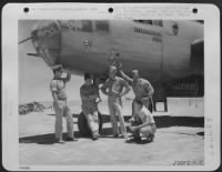 From an Advance North African Air Base (July 13). Shown above are members of a North American B-25 Mitchell "Missouri Waltz," which enemy flak forced into the sea 5 miles off the coast of Sicily. While in the sea, the crew was protected by Lockheed - Page 1