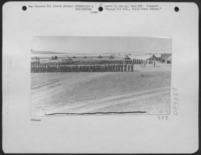 Consolidated > Presentation of awards and decorations to American Flying Fortress personnel at an advanced U.S.A.A.F. flying field "Somewhere in North Africa." Scene was taken at one of the numerous airdromes that dot the flat valleys of Northern Algeria and