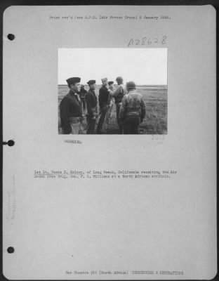 Thumbnail for Consolidated > 1st Lt. Verne B. Kelsey, of Long Beach, California receiving the Air Medal from Brig. Gen. P.L. Williams at a North African airfield.