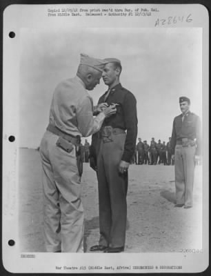 Thumbnail for Consolidated > 1st. Lt. Glade Jorgensen, of American Fork, Utah, receiving the Silver Star., from Lt. Gen. Frank M. Andrews, Commanding General of U.S. Army Forces in the Middle East. Lt. Jorgensen was awarded the Silver Star for gallantry in action in the capacity