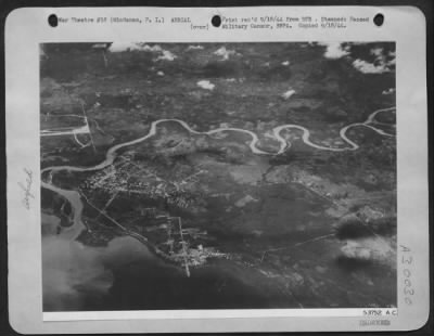 Thumbnail for Consolidated > This photograph of the town of Sasa in Mindanao was taken prior to a heavy bombardment by units of Gen. Kenney's Far Eastern AF. This is one of the first pictures of the Philippines released to the press. On the far left of the picture can be seen