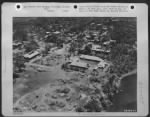 CAPITAL OF PALAWAN--Puerto Princesa, provincial capital of Palawan, was but a shell of a city when the American troops landed. At right center, is the American prisoner of war camp, scene of a Japanese atrocity in which approximately 140 Americans - Page 1