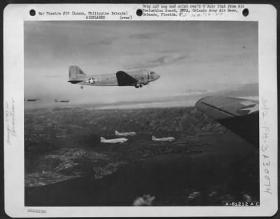 Consolidated > Douglas C-47 "Skytrains" in formation over Lake Taal, Luzon, Philippine Islands.