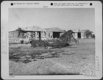 Consolidated > Buildings U.S. plane which were damaged during German night raid on an airport at Maison Blanche, Algeria. 21 November 1942.