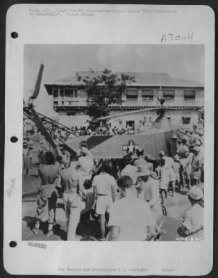 Thumbnail for Consolidated > FIRST HELICOPTER IN PHILIPPINES--Hundreds of curious Filipinos gather with officers and men of the U.S. Army 5th AF as the first Army helicopter to operate in the Philippines lands in a Leyte town. Helicopters have already proved useful in evacuating