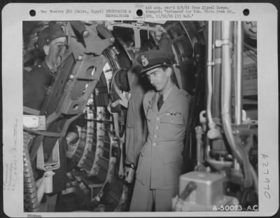 Consolidated > Cairo, Egypt-King Peter gets a bit of first hand information from the captain of one of the Consolidated B-24's by actual inspection of the inside and controls.