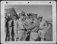 Col. Robert D. Knapp presents Distinguished Flying Cross to Lt. Rudolph at Soliman, Egypt in Africa, August 1943. - Page 1