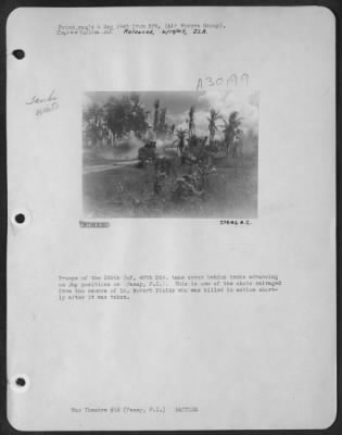 Consolidated > Troops of the 185th Inf, 40th Div. take cover behind tanks advancing on Jap positions on (Panay, P.I.). This is one of the shots salvaged from the camera of Lt. Robert Fields who was killed in action shortly after it was taken.