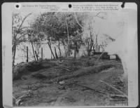 FUNERAL PYRE--This was an air raid shelter which the Japanese permitted American prisoners of war to construct for their own use. A few weeks before our forces invaded Palawan, the Japs sounded a fake alert and then after the prisoners had taken - Page 1