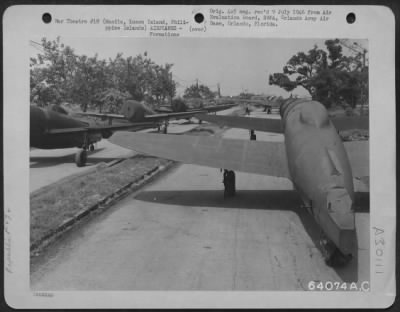 Consolidated > Republic P-47 "Thunderbolts" just unloaded from the ship await transportation to an airfield. Manila, Luzon Island, Philippine Islands, 6 August 1945.