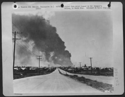 Thumbnail for Consolidated > Photo taken during the battle for Manila in February 1945. Santo Mesa Boulevard, and Santo Tomas Prison (center right, tower) may be seen in this photo.