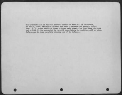Consolidated > The intricate maze of Japanese defenses inside the west wall of Intramuros, at Manila, Luzon, Philippine Islands, was heavily defended and savagely fought over. U.S. troops searching house to house under steady fire from these positions had to kill