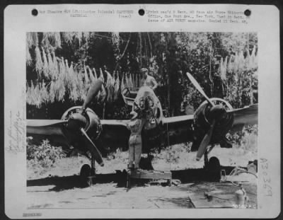 Consolidated > Head-on view of Jap fighter-bomber muzzle of cannon and three-bladed props. Palawan Island, P.I.