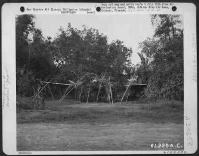 Consolidated > Camouflaged Japanese "Nick on Clark Field, Luzon, Philippine Islands.