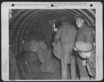 Consolidated > Cairo, Egypt-Mail bags being loaded aboard U.S. Army Transport in the Middle East to be flown to the fighting men in the desert.