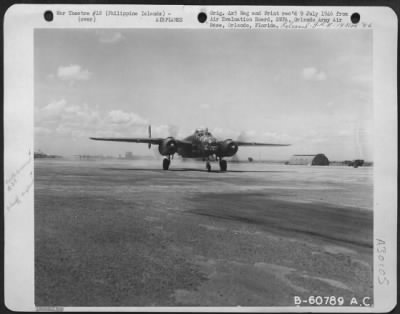 Consolidated > North American B-25 'Mitchell' Preparing For Take-Off From Clark Field, Manila, Philippine Islands.  1 June 1945.