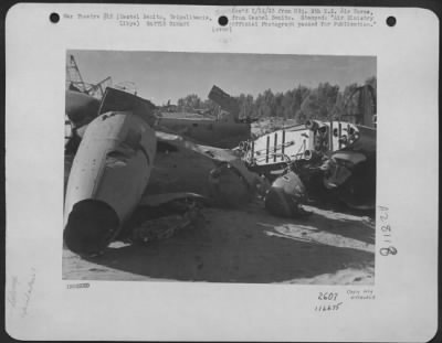 Thumbnail for Consolidated > A junk pile of enemy aircraft in a corner of Castel Benito Airfield, near Tripoli, Tripolitania, Libya.