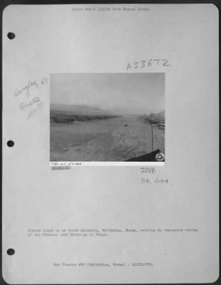 Thumbnail for Consolidated > Planes lined up at North Airstrip, Myitkyina, Burma, waiting to transport troops of the Chinese 14 Division to China.