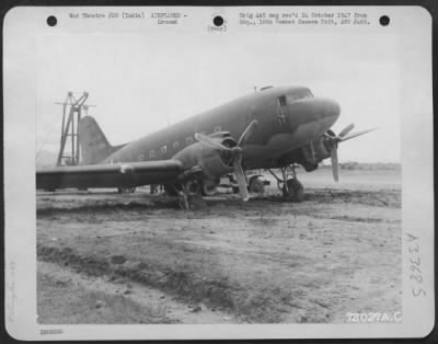 Consolidated > The monsoon season in India was a weather element the Air Force had to contend with. Here a Douglas C-47 with one wheel stuck in the mud had to be pulled out with the use of a hoist and a tractor. 12 September 1944.