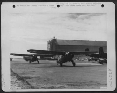 Consolidated > At a field near Karachi, India, Noorduyn C-64's taxi out onto the strip to take off on a flight to the field at Lalaghat, India. 1st Air Commando Force.