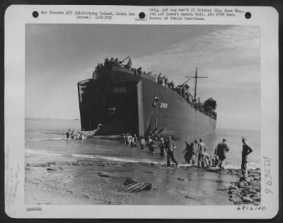 Thumbnail for Consolidated > Immediately after the LST (Landing Ship Tanks) beached, the 836th Engineers started to unload their heavy equipment to be used in construction of a landing strip on Middleburg Island, off the coast of Dutch New Guinea. 1 August 1944.