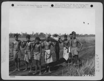 Thumbnail for Consolidated > Natives bearing wounded American troops behind the lines at Buna, Papua New Guinea.