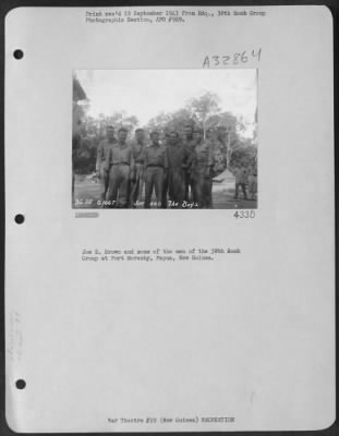 Consolidated > Joe E. Brown and some of the men of the 38th Bomb Group at Port Moresby, Papua, New Guinea.
