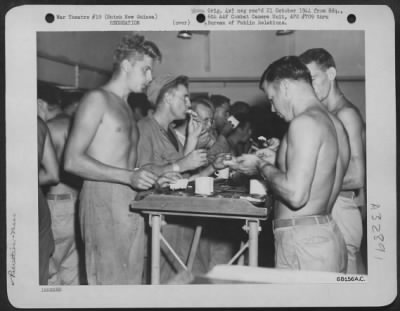 Thumbnail for Consolidated > Mess aboard a war-time army transport means standing up in a crowded hot hold far below deck. These men are en route to begin construction of airstrips on Middleburg Island and Cape Sansapor on the northern tip of Dutch New Guinea. 1944.