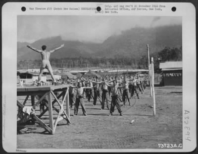 Consolidated > Calisthenics keep the Air Force personnel in good physical condition at a base somewhere in Hollandia, New Guinea.