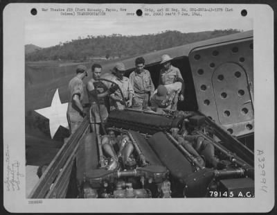 Thumbnail for Consolidated > Members of Directorate of Air Transport, Ward's Drome, Port Moresby, New Guinea, load worn out engines onto C-47 transport for shipment to Brisbane, Queensland, Australia, for repair. The transport is of ANA Lines under contract to US Army. April