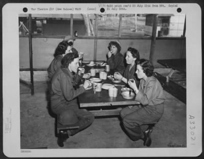 Thumbnail for Consolidated > Newly-arrived members of the Women's Army Corps enjoy their first meal at a camp somewhere in New Guinea. They are Pvt. Margaret Zavatsky of Edwardsville, Pennsylvania; Lt. Arline Schonerstedt of Georgetown, Texas; T/4 Gillied Tanksley of Bokoshe