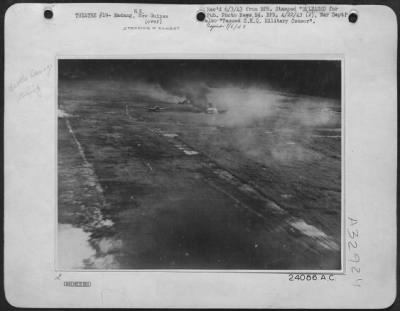 Consolidated > Japanese aircraft blazing on Mafaing airdrome during Friday's combined strafing attack by American Mitchells and RAAF Beaufighters. These remarkable pictures were taken from a Beaufighter attacking at ground level. The first picture shows a Japanese