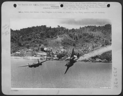Consolidated > Karas, Dutch New Guinea-One Douglas A-20 Havoc is caught by Jap flak, swerves out of control.