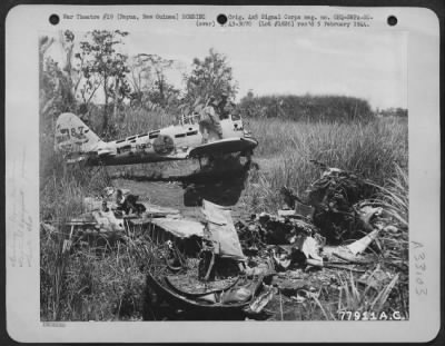 Thumbnail for Consolidated > Members of the 41st Division looking over Japanese Zero which was wrecked on the Old Jap Air Strip, Buna, Papua, New Guinea by bombing. 11 March 1943.