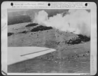 Shown along the Markham River, these American paratroops are closing the Japs back door to Lae. Some have landed but others are still in the air. Note the planes, also the smokescreen which conceals the action from the Japs across the river. - Page 1
