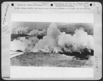 Thumbnail for Consolidated > IN FULL PANORAMIC DETAIL, this picture shows the attack on Nadzab at its height, with one battalion of paratroops descending from Douglas C-47s in the foreground, while in the distance (left) another battalion descends against a smokescreen and