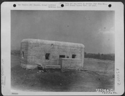 Thumbnail for Consolidated > Damaged Jap built pill-box near the Lashio Airstrip in Burma, showing direct hits by mortar and small arms fire. 11 March 1945.