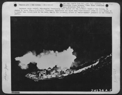 Consolidated > Japanese cargo vessel, zig-zagging frantically thru waters off the northern coast of New Guinea, is shaken by bombs from a U.S.A.A.F. Liberator. Experience has shown that "near-misses" often do more damage to a vessel than direct hits on the deck