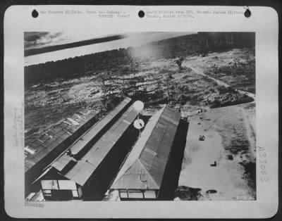 Thumbnail for Consolidated > GENERAL KENNEY'S AIRMEN, SO SORRY!------Parachute bombs, seemingly harmless, drift gently down on the roofs of the Jap installations at Babo, Dutch New Guinea. Unfortunately the camera was unable to record, several seconds laster, the blinding