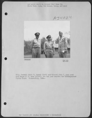Consolidated > Brig. General Caleb V. Haynes (left) and Colonel John F. Egan pose with Major P.C. Droz (right), who was just awarded the Distinguished Flying Cross. Sookerating, India.