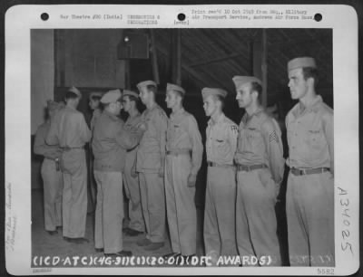 Thumbnail for Consolidated > Col. Charlie F. Skannal awarding the Distinguished Flying Cross to pilots at Chabua, India, the jump off base for the famous "Hump" run.