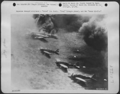 Consolidated > Japanese damaged airplanes-"Helen" (on fire). "Tony" (single plane), and two "Oscar MK-2's."