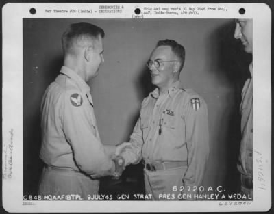 Consolidated > Lt. General George E. Stratemeyer congratulates Major General Thomas J. Hanley, Jr., after presenting him with the Air Medal at a base in India on 9 July 1945.