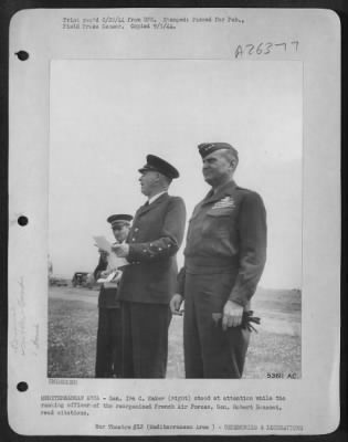 Thumbnail for Consolidated > MEDITERRANEAN AREA-Gen. Ira C. Eaker (right) stood at attention while the ranking officer of the reorganized French Air Forces, Gen. Robert Bouscat, read citations.