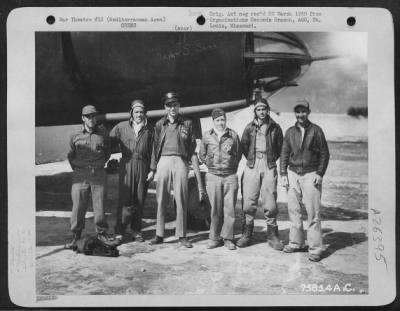 Consolidated > The crew of the Martin B-26 "Ole Seven 5 Seven" of the 34th Bomb Squadron, 17 Bomb Group pose beside their plane at an airfield somewhere in the Mediterranean Area.